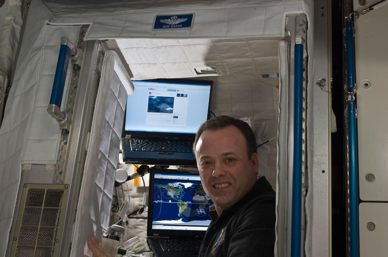 ISS028-E-045759 (10 Sept. 2011) --- NASA astronaut Ron Garan, Expedition 28 flight engineer, is pictured in his crew quarters compartment in the Harmony node of the International Space Station.