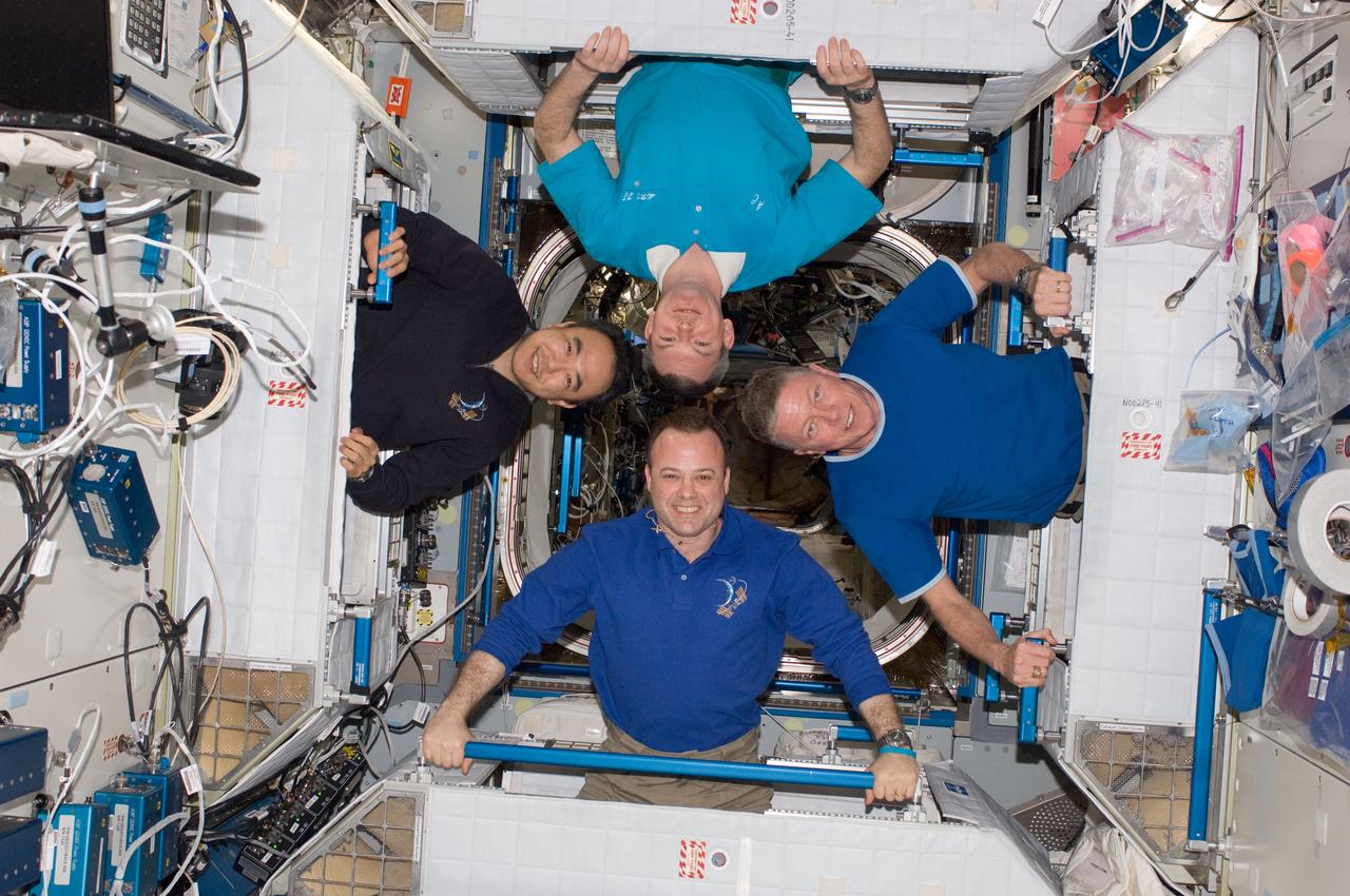 ISS028-E-048379 (12 Sept. 2011) --- Four of the six Expedition 28 crew members onboard the International Space Station pose for a photo in the Harmony node. Pictured clockwise (from the left) are Japan Aerospace Exploration Agency astronaut Satoshi Furukawa and Russian cosmonaut Alexander Samokutyaev; along with NASA astronauts Mike Fossum and Ron Garan, all flight engineers.