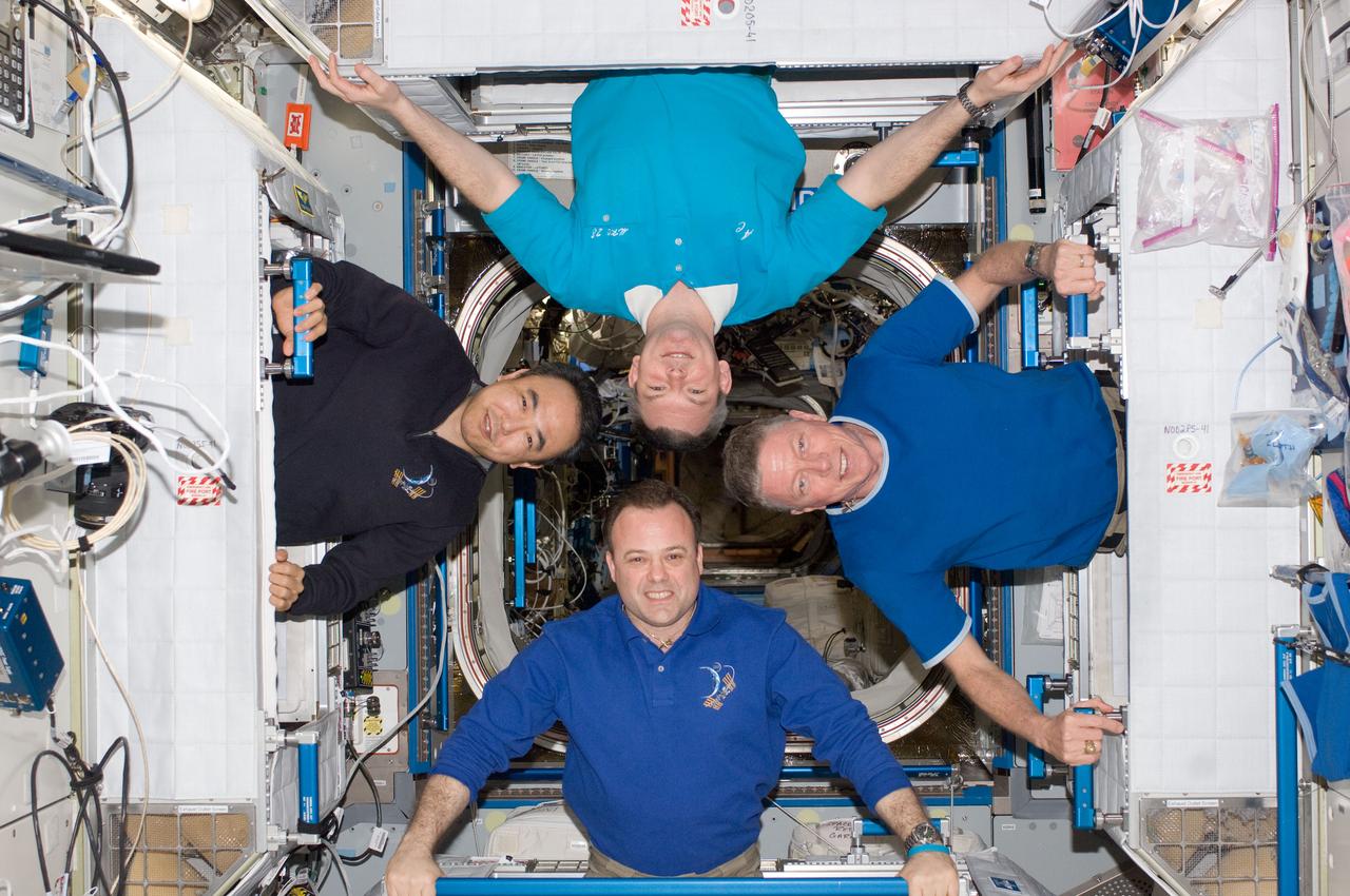 ISS028-E-048386 (12 Sept. 2011) --- Four of the six Expedition 28 crew members onboard the International Space Station pose for a photo in the Harmony node. Pictured clockwise (from the left) are Japan Aerospace Exploration Agency astronaut Satoshi Furukawa and Russian cosmonaut Alexander Samokutyaev; along with NASA astronauts Mike Fossum and Ron Garan, all flight engineers.