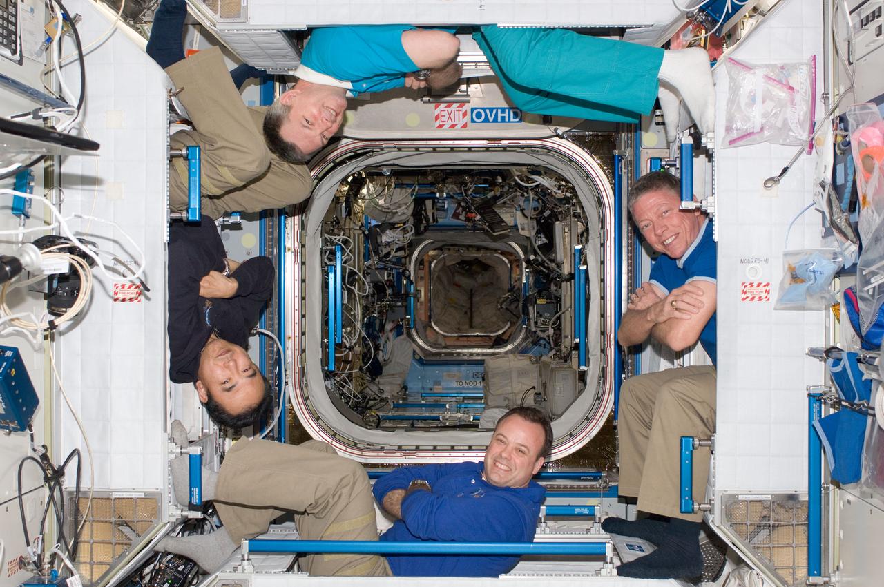 ISS028-E-048388 (12 Sept. 2011) --- Four of the six Expedition 28 crew members onboard the International Space Station pose for a photo in the Harmony node. Pictured clockwise (from the left) are Japan Aerospace Exploration Agency astronaut Satoshi Furukawa and Russian cosmonaut Alexander Samokutyaev; along with NASA astronauts Mike Fossum and Ron Garan, all flight engineers.
