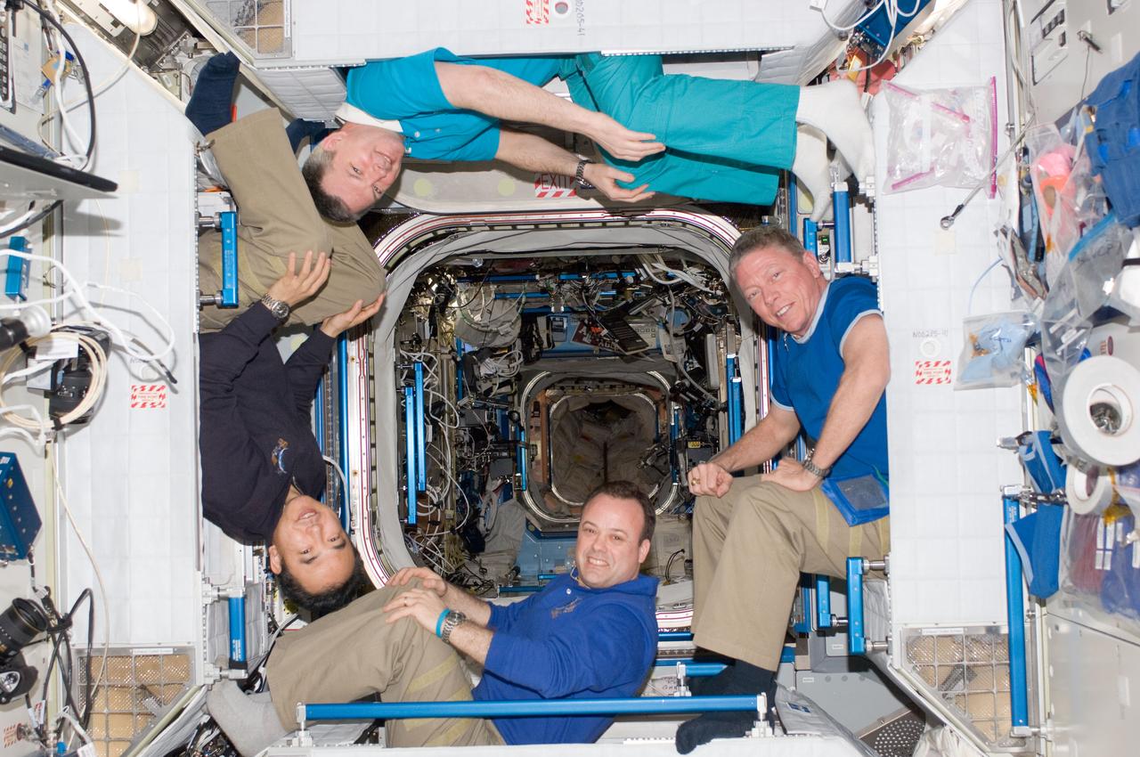 ISS028-E-048394 (12 Sept. 2011) --- Four of the six Expedition 28 crew members onboard the International Space Station pose for a photo in the Harmony node. Pictured clockwise (from the left) are Japan Aerospace Exploration Agency astronaut Satoshi Furukawa and Russian cosmonaut Alexander Samokutyaev; along with NASA astronauts Mike Fossum and Ron Garan, all flight engineers.