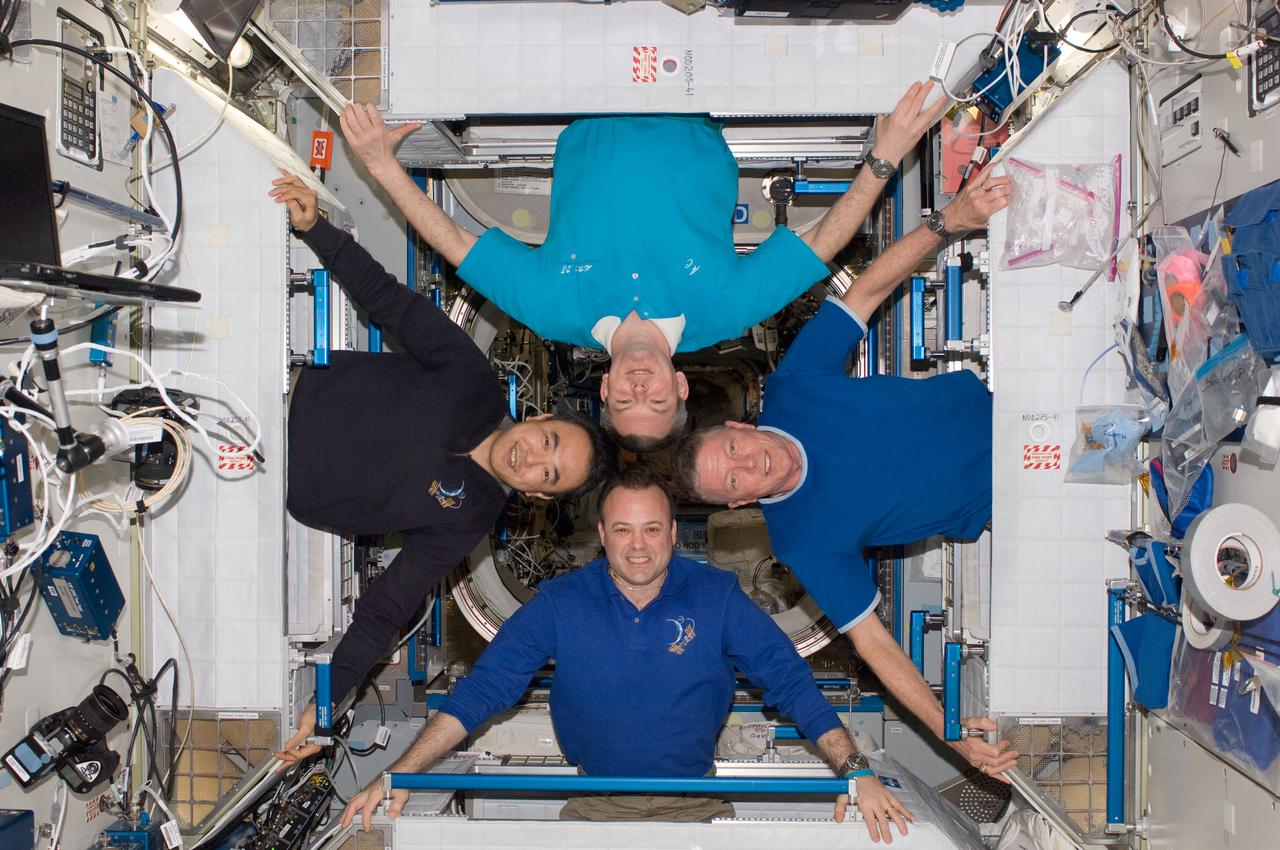 ISS028-E-048400 (12 Sept. 2011) --- Four of the six Expedition 28 crew members onboard the International Space Station pose for a photo in the Harmony node. Pictured clockwise (from the left) are Japan Aerospace Exploration Agency astronaut Satoshi Furukawa and Russian cosmonaut Alexander Samokutyaev; along with NASA astronauts Mike Fossum and Ron Garan, all flight engineers.