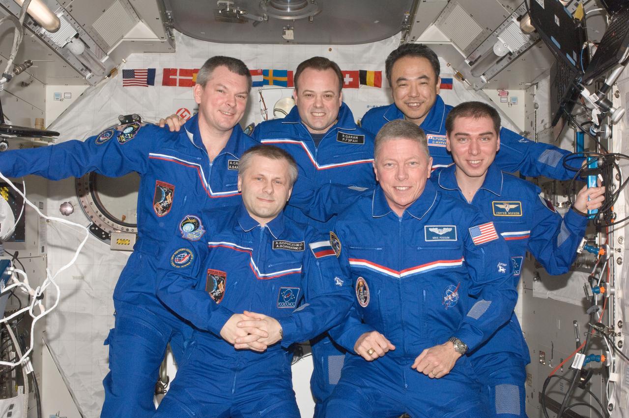 ISS028-E-049074 (14 Sept. 2011) --- Expedition 28 crew members pose for a traditional in-flight crew portrait in the Kibo laboratory of the International Space Station. Pictured from the left (front row) are Russian cosmonaut Andrey Borisenko, commander; NASA astronaut Mike Fossum and Russian cosmonaut Sergei Volkov, both flight engineers. From the left (back row) are Russian cosmonaut Alexander Samokutyaev, NASA astronaut Ron Garan and Japan Aerospace Exploration Agency astronaut Satoshi Furukawa, all flight engineers.