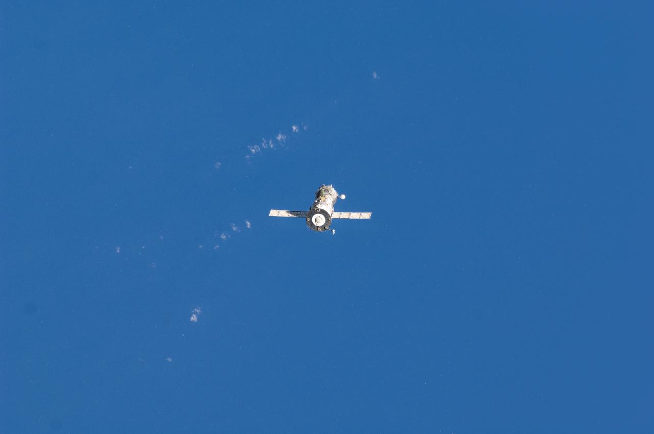 ISS029-E-005021 (16 Sept. 2011) --- Backdropped against blue skies, the Soyuz TMA- 21 spacecraft departs from the International Space Station and heads toward a landing in a remote area outside the town of Zhezkazgan, Kazakhstan, on Sept. 16, 2011. NASA astronaut Ron Garan, flight engineer, along with Expedition 28 commander Andrey Borisenko and flight engineer Alexander Samokutyaev, both of the Russian Federal Space Agency, are returning from more than five months onboard the International Space Station where they served as members of the Expedition 27 and 28 crews.