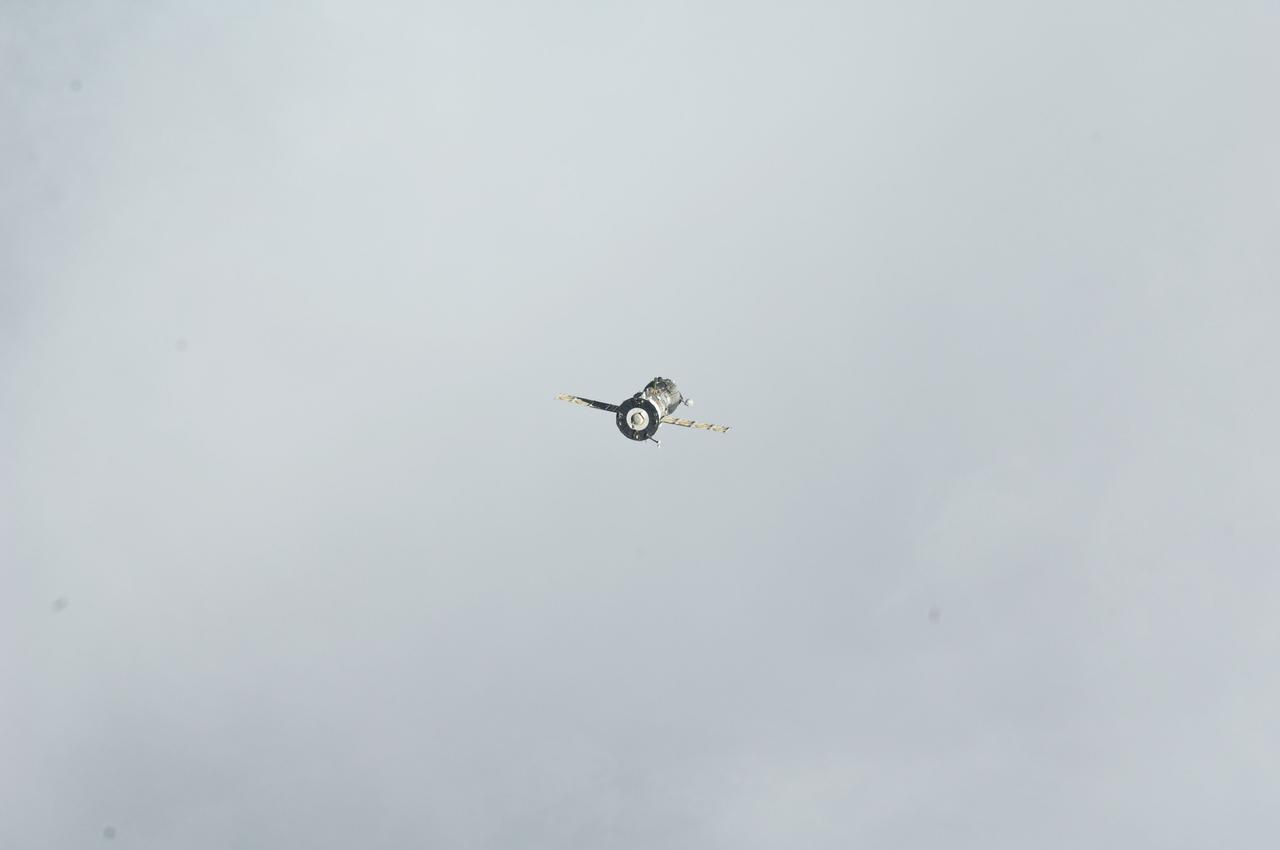ISS029-E-005030 (16 Sept. 2011) --- Backdropped against a grayish sky, the Soyuz TMA-21 spacecraft departs from the International Space Station and heads toward a landing in a remote area outside the town of Zhezkazgan, Kazakhstan, on Sept. 16, 2011. NASA astronaut Ron Garan, flight engineer, along with Expedition 28 commander Andrey Borisenko and flight engineer Alexander Samokutyaev, both of the Russian Federal Space Agency, are returning from more than five months onboard the International Space Station where they served as members of the Expedition 27 and 28 crews.