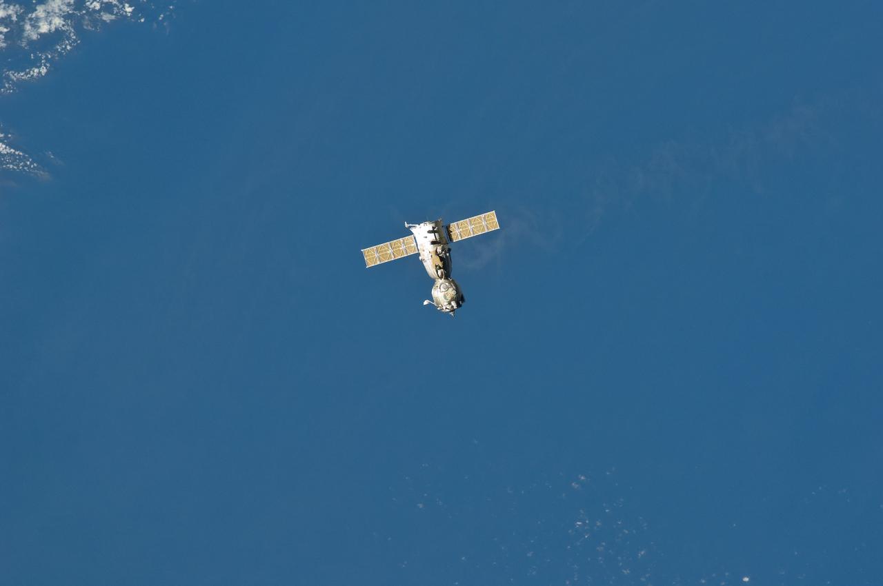 ISS029-E-005083 (16 Sept. 2011)  ---  Backdropped against blue sky, the Soyuz TMA-21 spacecraft departs from the International Space Station and heads toward a landing in a remote area outside the town of Zhezkazgan, Kazakhstan, on  Sept. 16, 2011. NASA astronaut Ron Garan, flight engineer, along with Expedition 28 commander Andrey Borisenko and flight engineer Alexander Samokutyaev, both of the Russian Federal Space Agency, are returning from more than five months onboard the International Space Station where they served as members of the Expedition 27 and 28 crews.