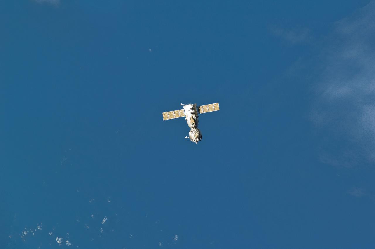 ISS029-E-005086 (16 Sept. 2011)  ---  Backdropped against blue sky, the Soyuz TMA-21 spacecraft departs from the International Space Station and heads toward a landing in a remote area outside the town of Zhezkazgan, Kazakhstan, on  Sept. 16, 2011. NASA astronaut Ron Garan, flight engineer, along with Expedition 28 commander Andrey Borisenko and flight engineer Alexander Samokutyaev, both of the Russian Federal Space Agency, are returning from more than five months onboard the International Space Station where they served as members of the Expedition 27 and 28 crews.