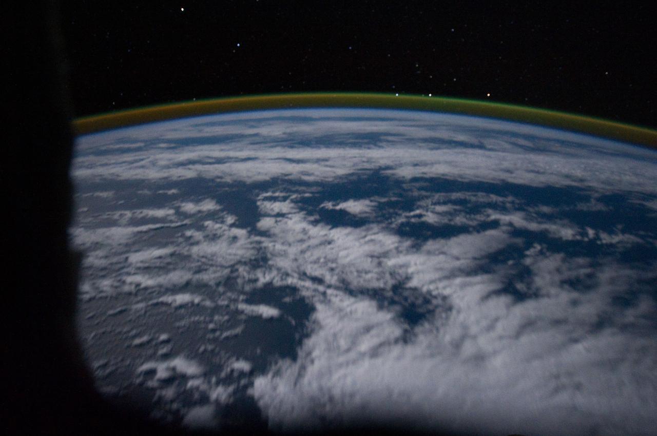 ISS029-E-005312 (16 Sept. 2011) --? One of the Expedition 29 crew members aboard the International Space Station, flying at an altitude of approximately 220 miles, took this picture over the South Atlantic Ocean, showing airglow, a number of stars and moon glint (on lower left side of image). Nadir coordinates are 37.17 degrees south latitude and 16.7 degrees west longitude.