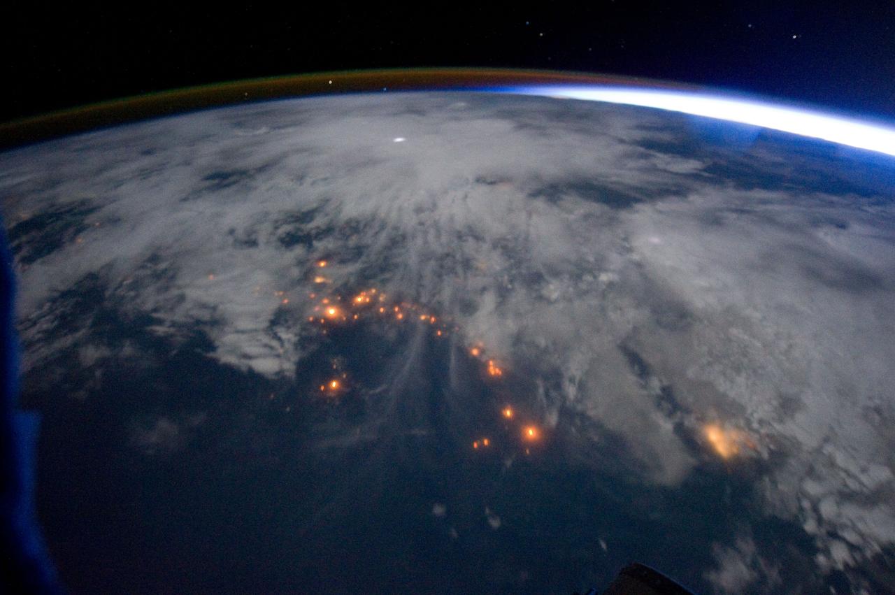 ISS029-E-005343 (16 Sept. 2011) --? One of the Expedition 29 crew members aboard the International Space Station, approximately 220 miles above Earth, took this night time picture showing clouds, lightning, airglow, Earth's terminator and lights of civilization along the central west coast of Africa. Nadir coordinates are 9.04 degrees south latitude and 10.18 degrees east longitude.