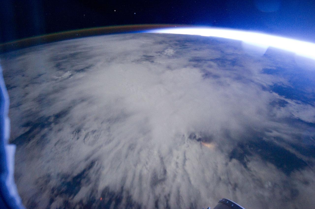 ISS029-E-005352 (16 Sept. 2011) --? One of the Expedition 29 crew members aboard the International Space Station, flying at an altitude of approximately 220 miles, took this night time picture showing Africa's Congo coast, clouds, airglow and Earth's terminator. Nadir coordinates are 5.32 degrees south latitude and 12.86 degrees east longitude.
