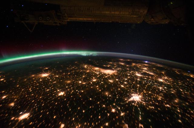 NASA image: Aurora Borealis and city lights on the horizon  taken by the Expedition 29 crew