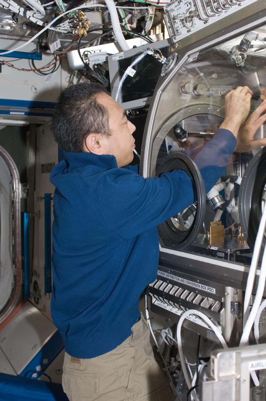 ISS029-E-027431 (17 Oct. 2011) --- In the International Space Station?s Destiny laboratory, Japan Aerospace Exploration Agency astronaut Satoshi Furukawa, Expedition 29 flight engineer, activates the Microgravity Science Glovebox (MSG) in preparation for work with the Selectable Optical Diagnostics Instrument ? Colloid (SODI-COLLOID) hardware.
