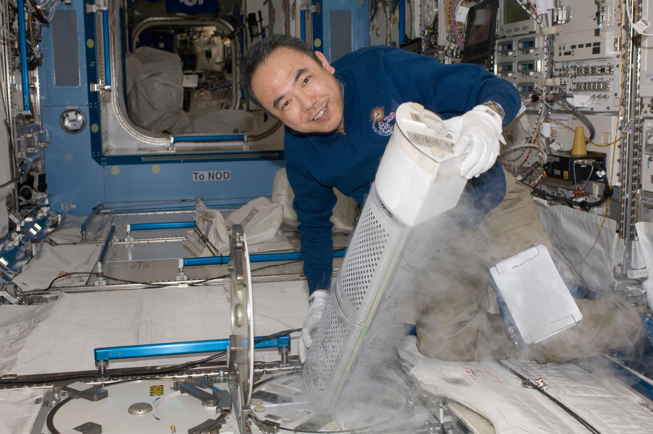 iss029e028495 (10/18/2011) --- Japan Aerospace Exploration Agency astronaut Satoshi Furukawa,Expedition 29 flight engineer,prepares to put samples from the CSA (Canadian Space Agency) Vascular Blood Collection protocol into the MELFI-1 (Minus Eighty Laboratory Freezer for ISS 1) unit.