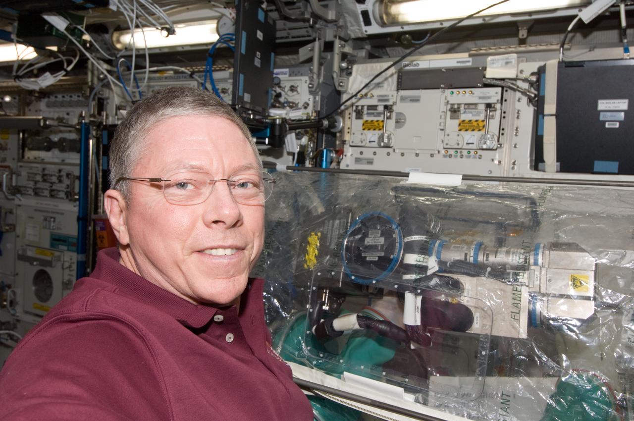 ISS029-E-029756 (17 Oct. 2011) --- NASA astronaut Mike Fossum, Expedition 29 commander, works on the Combustion Integrated Rack / Fluids & Combustion Facility (CIR FCF) in the Destiny laboratory of the International Space Station.
