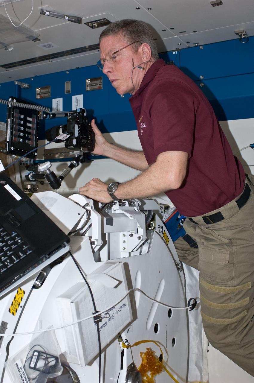 ISS029-E-032410 (24 Oct. 2011) --- NASA Mike Fossum, Expedition 29 commander, conducts a session with the Binary Colloidal Alloy Test-6 (BCAT-6) experiment in the Kibo laboratory of the International Space Station.