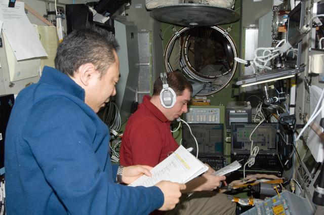 NASA image: Volkov and Furukawa during 45P docking with ISS