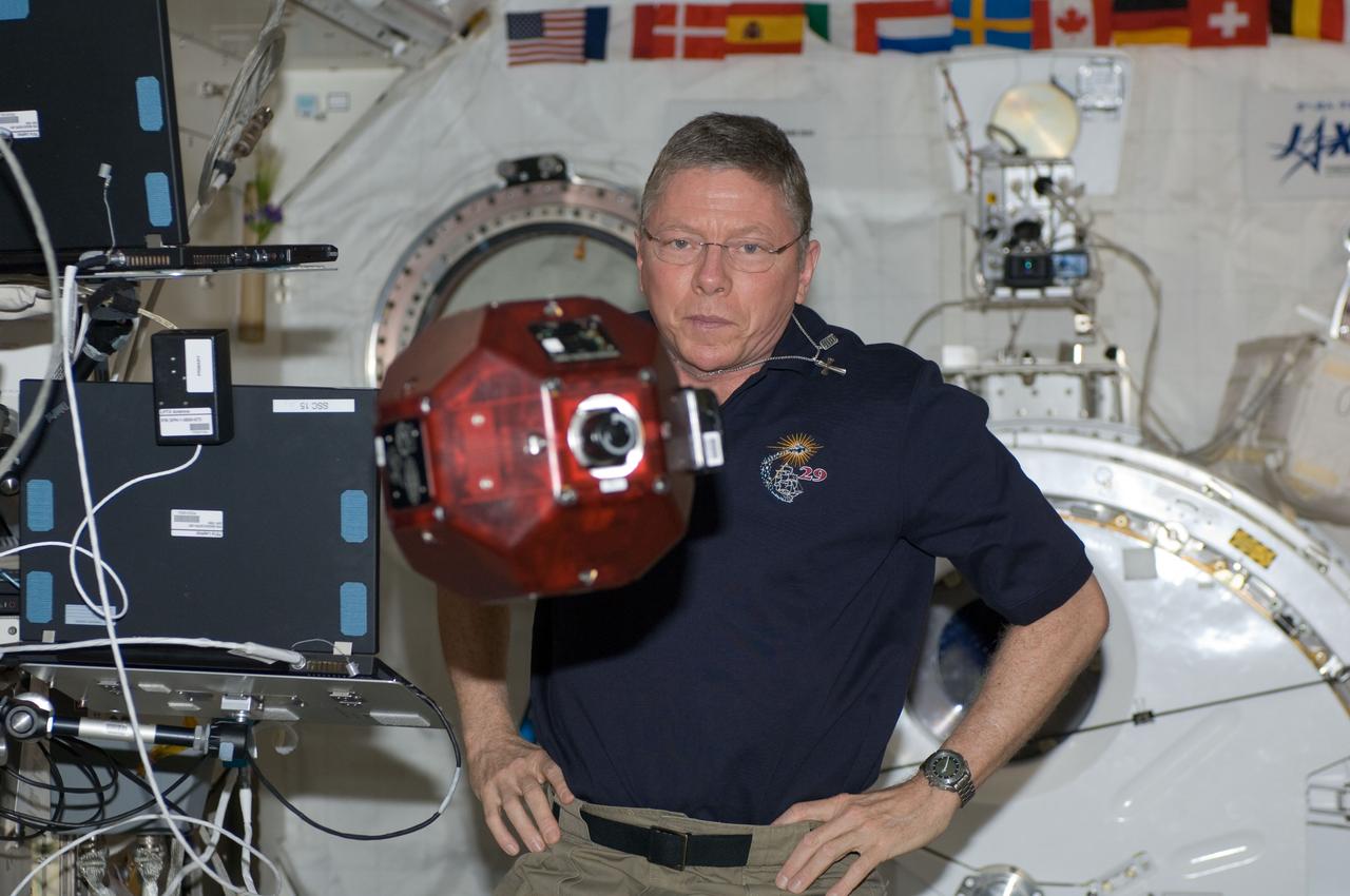 ISS029-E-036497 (1 Nov. 2011) --- NASA astronaut Mike Fossum, Expedition 29 commander, conducts a session of the Synchronized Position Hold, Engage, Reorient, Experimental Satellites (SPHERES) program in the Kibo laboratory of the International Space Station.