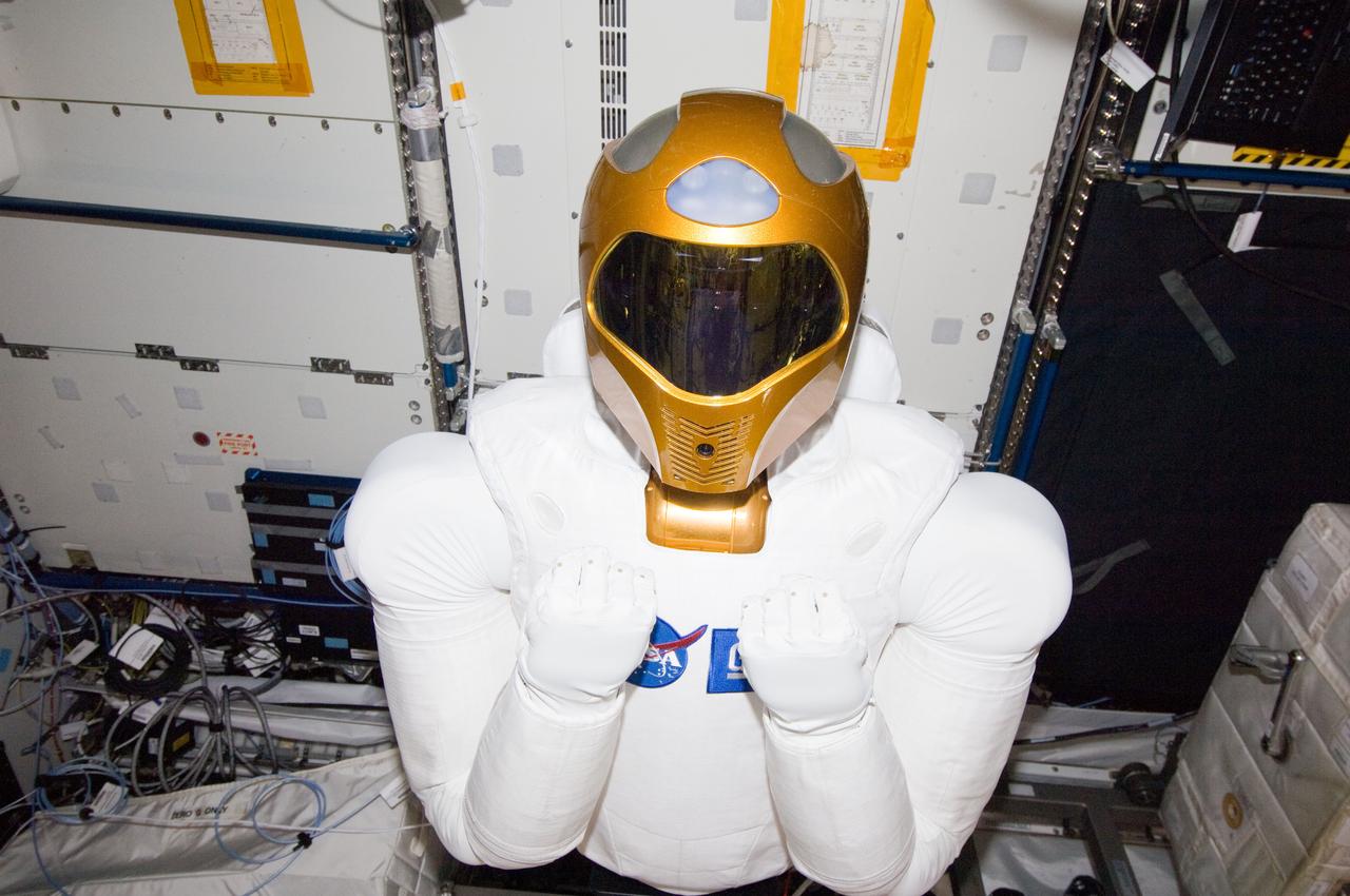 ISS029-E-039197 (4 Nov. 2011) --- Robonaut 2 -- the first dexterous humanoid robot in space ? is pictured in the Destiny laboratory of the International Space Station. NASA astronaut Mike Fossum, Expedition 29 commander; and Japan Aerospace Exploration Agency astronaut Satoshi Furukawa (both out of frame), flight engineer, spent several hours in Destiny checking out and operating R2.