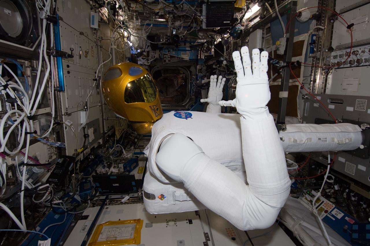 ISS029-E-039219 (4 Nov. 2011) --- Robonaut 2 -- the first dexterous humanoid robot in space ? is pictured in the Destiny laboratory of the International Space Station. NASA astronaut Mike Fossum, Expedition 29 commander; and Japan Aerospace Exploration Agency astronaut Satoshi Furukawa (both out of frame), flight engineer, spent several hours in Destiny checking out and operating R2.