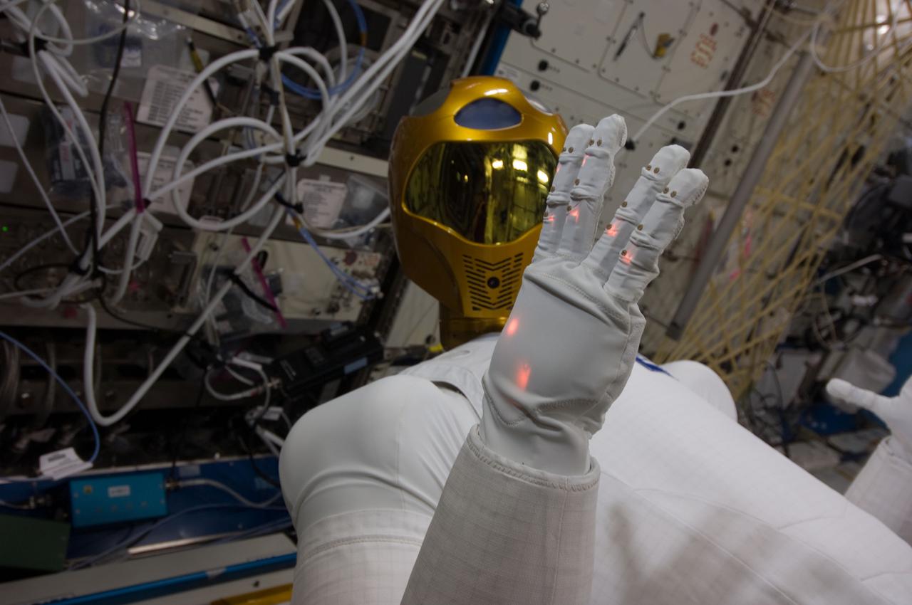 ISS029-E-039226 (4 Nov. 2011) --- Robonaut 2 -- the first dexterous humanoid robot in space ? is pictured in the Destiny laboratory of the International Space Station. NASA astronaut Mike Fossum, Expedition 29 commander; and Japan Aerospace Exploration Agency astronaut Satoshi Furukawa (both out of frame), flight engineer, spent several hours in Destiny checking out and operating R2.
