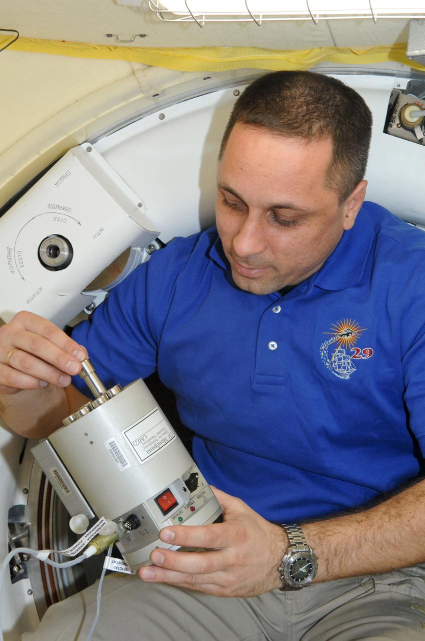 ISS029-E-042539 (17 Nov. 2011) --- Russian cosmonaut Anton Shkaplerov is pictured onboard the International Space Station working with the biological BTKh-35 MEMBRANE experiment. Shkaplerov is one of three Expedition 29 crew members who recently joined three original Expedition 29 crew members aboard the orbiting complex. In a few days he will become a flight engineer on the Expedition 30 crew.