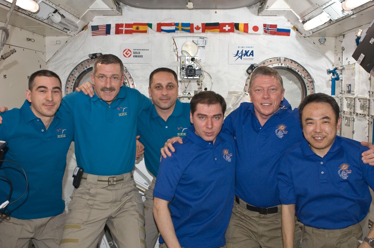 ISS029-E-043148 (20 Nov. 2011) --- Expedition 28/29 and Expedition 29/30 crew members pose for a group portrait in the International Space Station?s Kibo laboratory following the ceremony of Changing-of-Command from Expedition 29 to Expedition 30. Pictured from the left are Russian cosmonaut Anatoly Ivanishin, Expedition 30 flight engineer; NASA astronaut Dan Burbank, Expedition 30 commander; Anton Shkaplerov, Expedition 30 flight engineer; Russian cosmonaut Sergei Volkov, Expedition 29 flight engineer; NASA astronaut Mike Fossum, Expedition 29 commander; and Japan Aerospace Exploration Agency astronaut Satoshi Furukawa, Expedition 29 flight engineer.