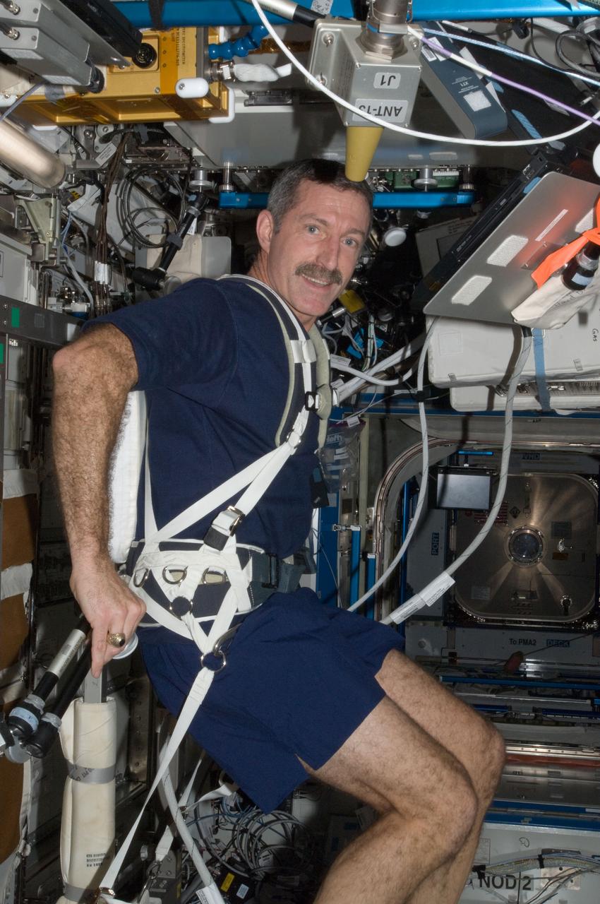 ISS030-E-007559 (4 Dec. 2011) --- NASA astronaut Dan Burbank, Expedition 30 commander, exercises on the Cycle Ergometer with Vibration Isolation System (CEVIS) in the Destiny laboratory of the International Space Station.