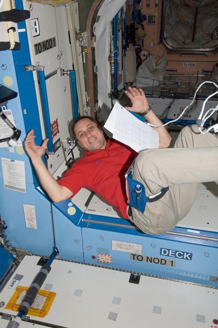 NASA image: Shkaplerov holds communication equipment in the U.S. Laboratory