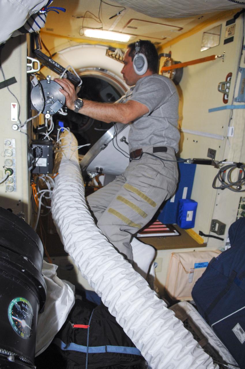 ISS030-E-010536 (14 Dec. 2011) --- Russian cosmonaut Anton Shkaplerov, Expedition 30 flight engineer, conducts an active session for the Russian experiment KPT-10 “Kulonovskiy Kristall” (Coulomb Crystal) in the Poisk Mini-Research Module 2 (MRM2) of the International Space Station.