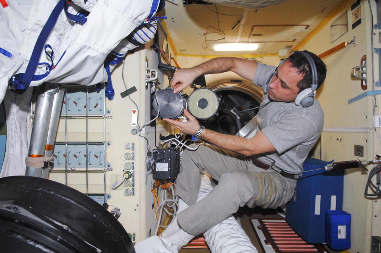 ISS030-E-010539 (14 Dec. 2011) --- Russian cosmonaut Anton Shkaplerov, Expedition 30 flight engineer, conducts an active session for the Russian experiment KPT-10 “Kulonovskiy Kristall” (Coulomb Crystal) in the Poisk Mini-Research Module 2 (MRM2) of the International Space Station.