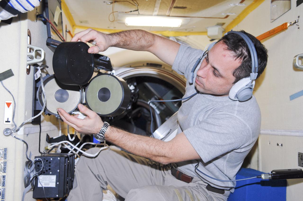 ISS030-E-010540 (14 Dec. 2011) --- Russian cosmonaut Anton Shkaplerov, Expedition 30 flight engineer, conducts an active session for the Russian experiment KPT-10 ?Kulonovskiy Kristall? (Coulomb Crystal) in the Poisk Mini-Research Module 2 (MRM2) of the International Space Station.