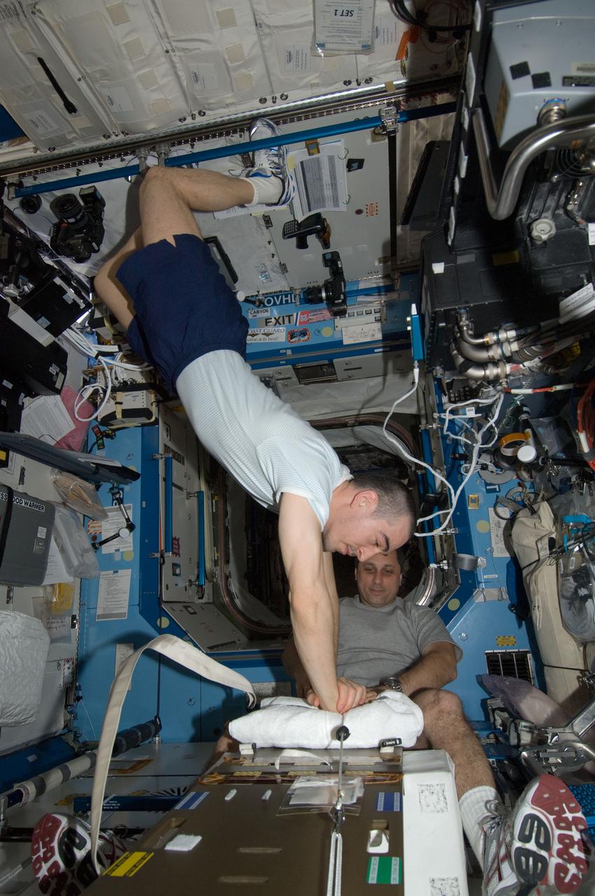 ISS030-E-012604 (16 Dec. 2011) --- Russian cosmonauts Anatoly Ivanishin (foreground) and Anton Shkaplerov, both Expedition 30 flight engineers, participate in a Crew Health Care System (CHeCS) medical contingency drill in the Destiny laboratory of the International Space Station. This drill gives crew members the opportunity to work as a team in resolving a simulated medical emergency onboard the space station.