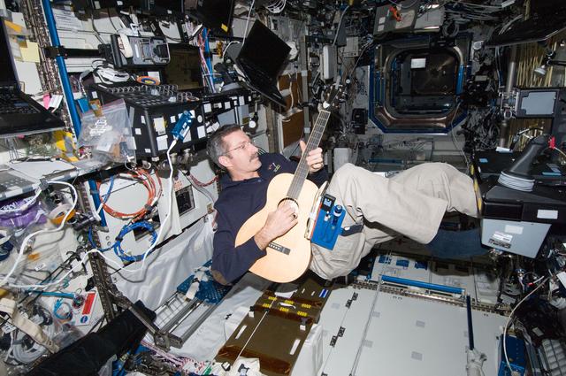 NASA image: Burbank plays a guitar in the U.S. Laboratory