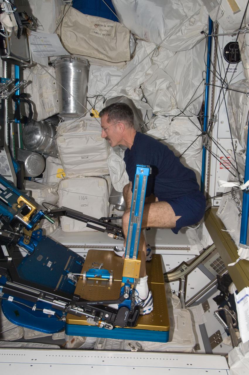 ISS030-E-012663 (18 Dec. 2011) --- NASA astronaut Dan Burbank, Expedition 30 commander, exercises using the advanced Resistive Exercise Device (aRED) in the Tranquility node of the International Space Station.