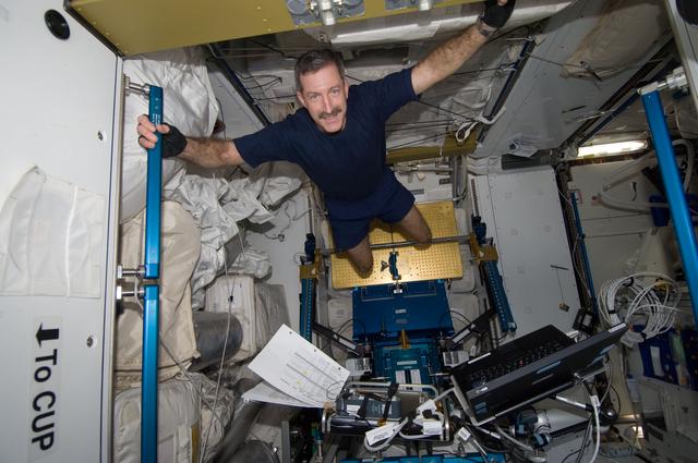 NASA image: Burbank takes a break during an exercise session using the ARED in the Node 3