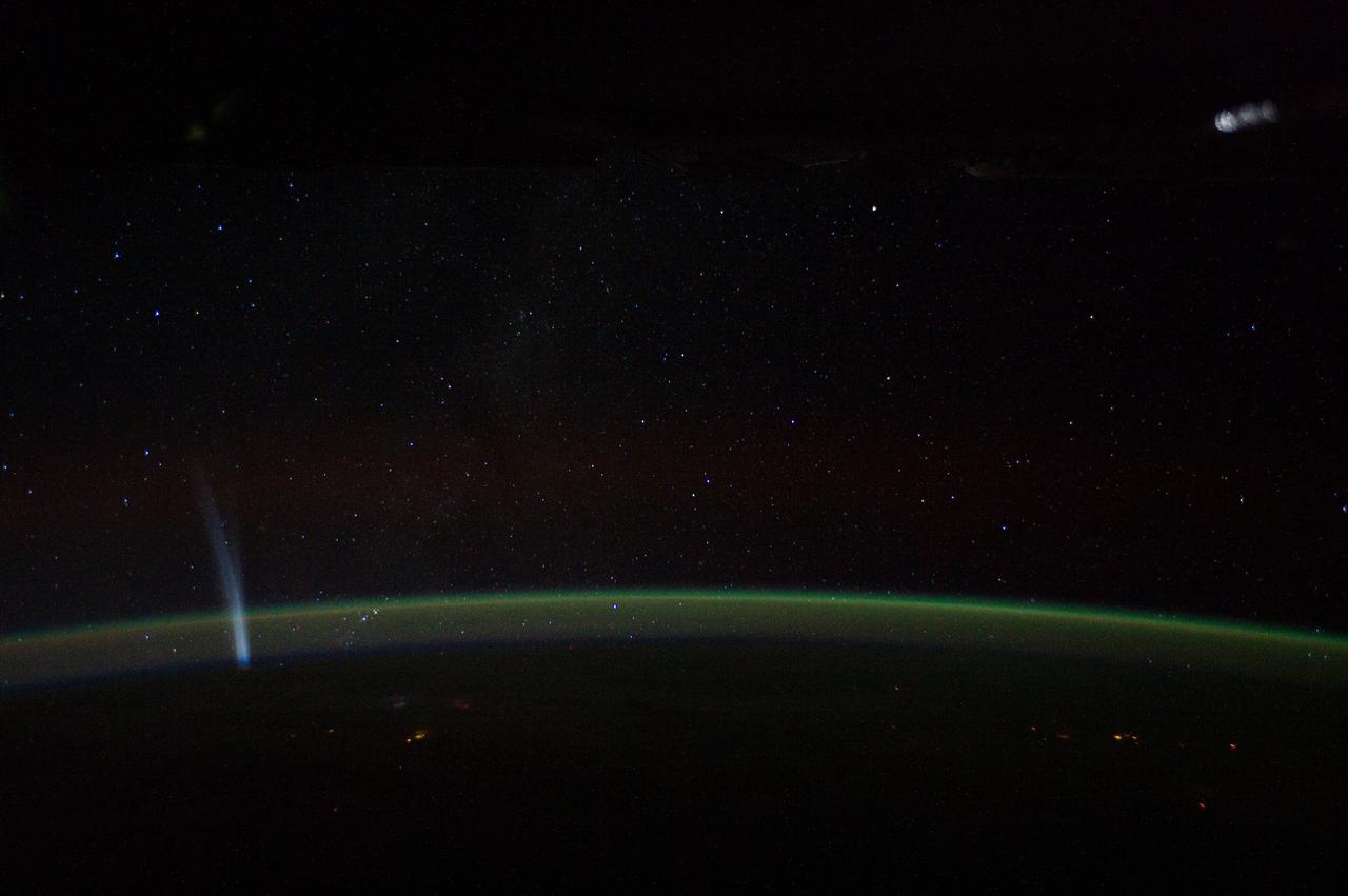ISS030-E-014312 (21 Dec. 2011) --- Comet Lovejoy is visible near Earth’s horizon in this nighttime image photographed by NASA astronaut Dan Burbank, Expedition 30 commander, onboard the International Space Station on Dec. 21, 2011.