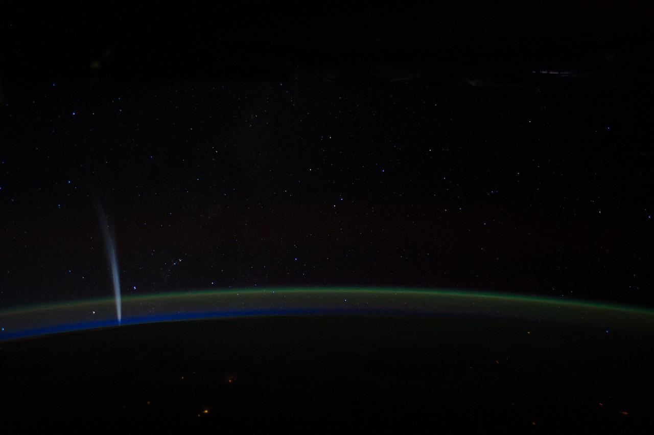 ISS030-E-014336 (21 Dec. 2011) --- Comet Lovejoy is visible near Earth’s horizon in this nighttime image photographed by NASA astronaut Dan Burbank, Expedition 30 commander, onboard the International Space Station on Dec. 21, 2011.