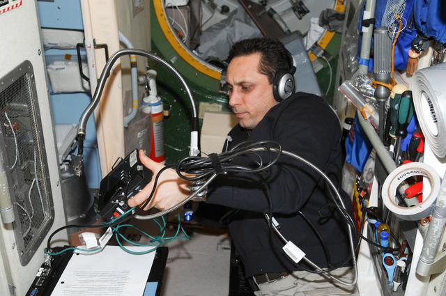 NASA image: Shkaplerov uses a Video Display Unit in the SM
