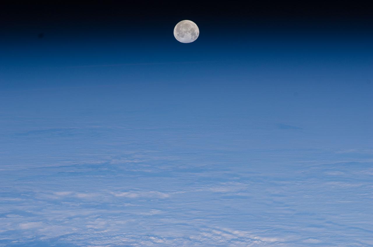 ISS030-E-028800 (9 Jan. 2012) ---    One of a series of photos of the moon and Earth’s atmosphere as seen from the International Space Station over a period of time that covered a number of orbits by the orbital outpost.