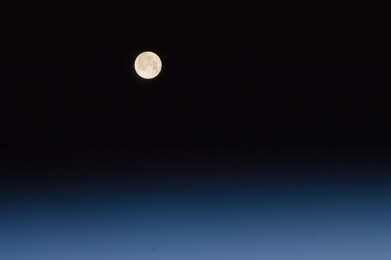 ISS030-E-028873 (9 Jan. 2012) --- One of a series of photos of the moon and Earth?s atmosphere as seen from the International Space Station over a period of time that covered a number of orbits by the orbital outpost.