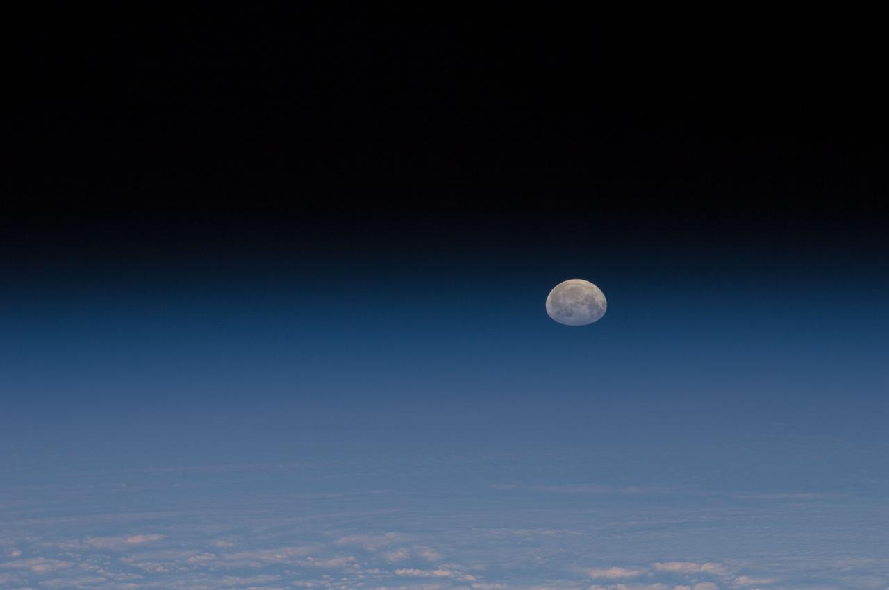 ISS030-E-028984 (9 Jan. 2012) --- One of a series of photos of the moon and Earth?s atmosphere as seen from the International Space Station over a period of time that covered a number of orbits by the orbital outpost.