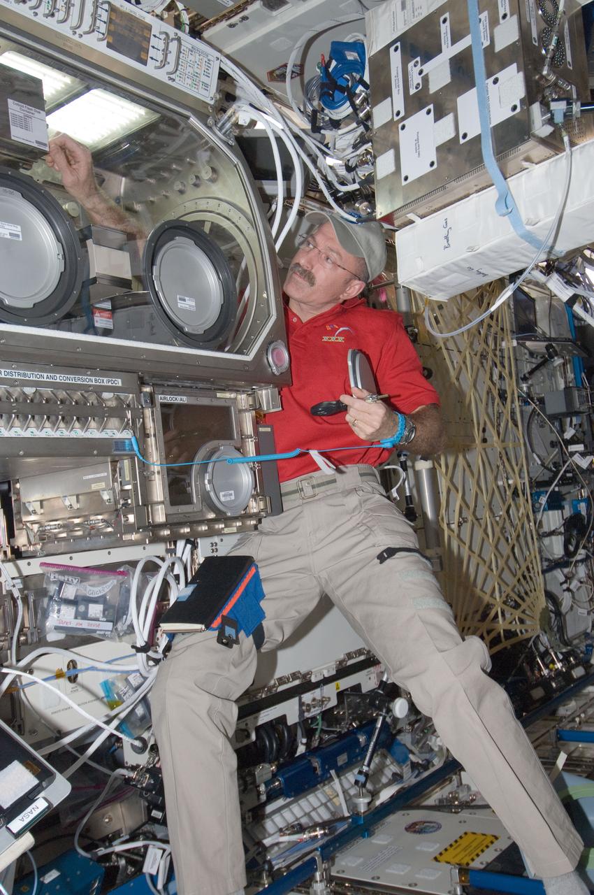 ISS030-E-030125 (10 Jan. 2012) --- NASA astronaut Dan Burbank, Expedition 30 commander, works on the Selectable Optical Diagnostics Instrument C Colloid (SODI-COLLOID) hardware in the Microgravity Science Glovebox in the International Space Station?s Destiny laboratory. Burbank is supporting ground-commanded operations by exchanging out some disks. COLLOID is part of ESA?s triple experiment series for advancement in liquids, diffusion measurements in petroleum reservoirs and the study on growth and properties of advanced photonic materials within colloidal solutions. The commander is currently joined by five other Expedition 30 astronauts and cosmonauts, all flight engineers, aboard the orbital outpost.