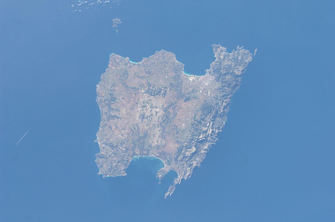ISS030-E-030290 (31 Dec. 2011) --- Majorca in the Balearic Islands (Spain) is featured in this image photographed by an Expedition 30 crew member aboard the International Space Station. The Balearic Islands are an archipelago located to the southwest of Spain in the Mediterranean Sea. Catalan – the native tongue – and Spanish are the official languages. The islands are an autonomous community and province of Spain, located approximately midway between the southeastern coastline of Spain and the northern coastline of Algeria. This photograph highlights the large island of Majorca (approximately 5,400 square kilometers; also known as Mallorca in Spanish) on which the capital city of Palma is located (center). The small island of Cabrera to the southwest of Majorca (upper left) hosts the Parc Nacional de l’Arxipelag de Cabrera (site mainly in Spanish). Like the other Balearic Islands, Majorca is a popular holiday destination for the European community with tourism forming a major part of the island’s economy. The island’s physiography offers many recreational opportunities – mountainous regions are present along the northwest coastline and eastern third, while much of the central part of the island is flat. Diving is also a popular activity. The central region includes agricultural lands (tan, light brown, and green, center), forested patches and corridors (dark green, center), and urban centers (gray). In addition to Majorca, the other major islands of the archipelago include Ibiza, Formentera, and Minorca.
