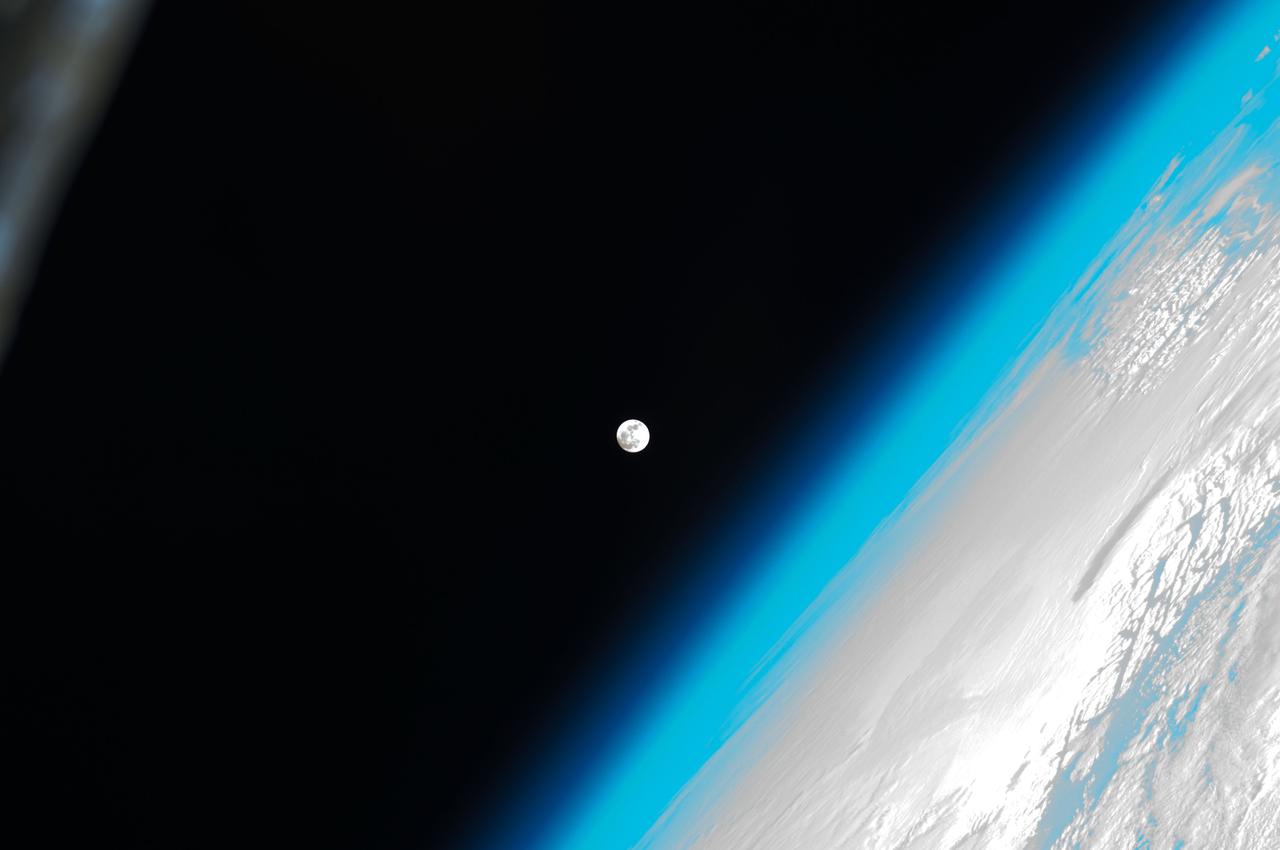 ISS030-E-031276 (8 Jan. 2012) --- One of a series of photos of the moon and Earth's atmosphere as seen from the International Space Station over a period of time that covered a number of orbits by the orbital outpost.
