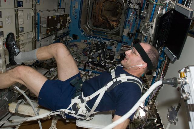 NASA image: Pettit exercises on the CEVIS in the U.S. Laboratory