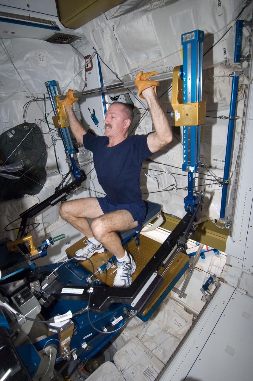 ISS030-E-033043 (9 Jan. 2012) --- NASA astronaut Dan Burbank, Expedition 30 flight commander, exercises, using the advanced Resistive Exercise Device (aRED) in the Tranquility node of the International Space Station.