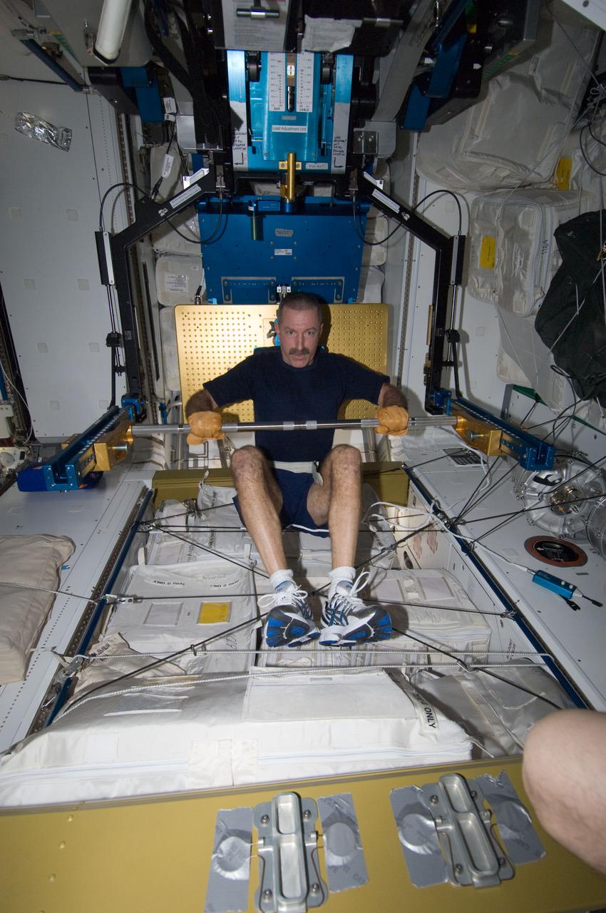 ISS030-E-033063 (9 Jan. 2012) --- NASA astronaut Dan Burbank, Expedition 30 flight commander, exercises, using the advanced Resistive Exercise Device (aRED) in the Tranquility node of the International Space Station.