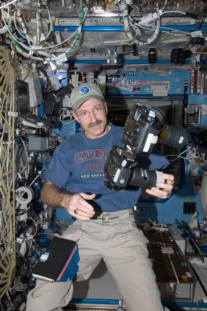 NASA image: Burbank holds still camera in the U.S. Laboraotry