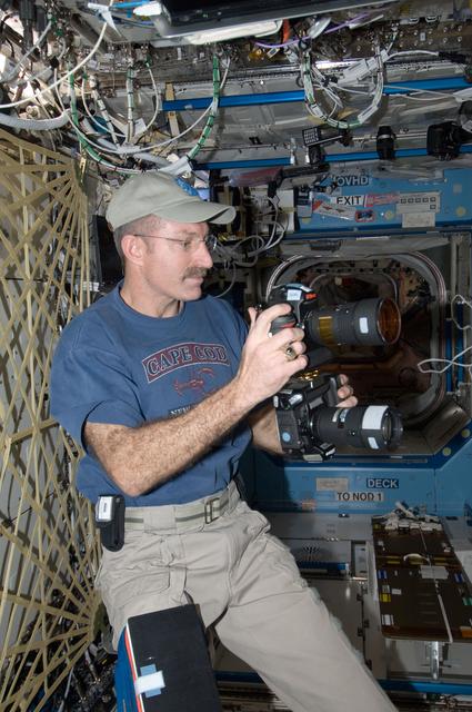 NASA image: Burbank holds still camera in the U.S. Laboraotry