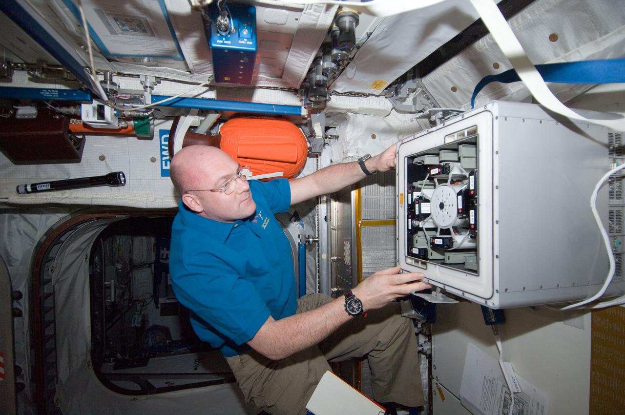 ISS030-E-033238 (24 Dec. 2011) --- European Space Agency astronaut Andre Kuipers, Expedition 30 flight engineer, works with the ESA Role of Apoptosis in Lymphocyte Depression 2 (ROALD-2) experiment in the KUBIK-3 thermostatic container located in the Columbus laboratory of the International Space Station.